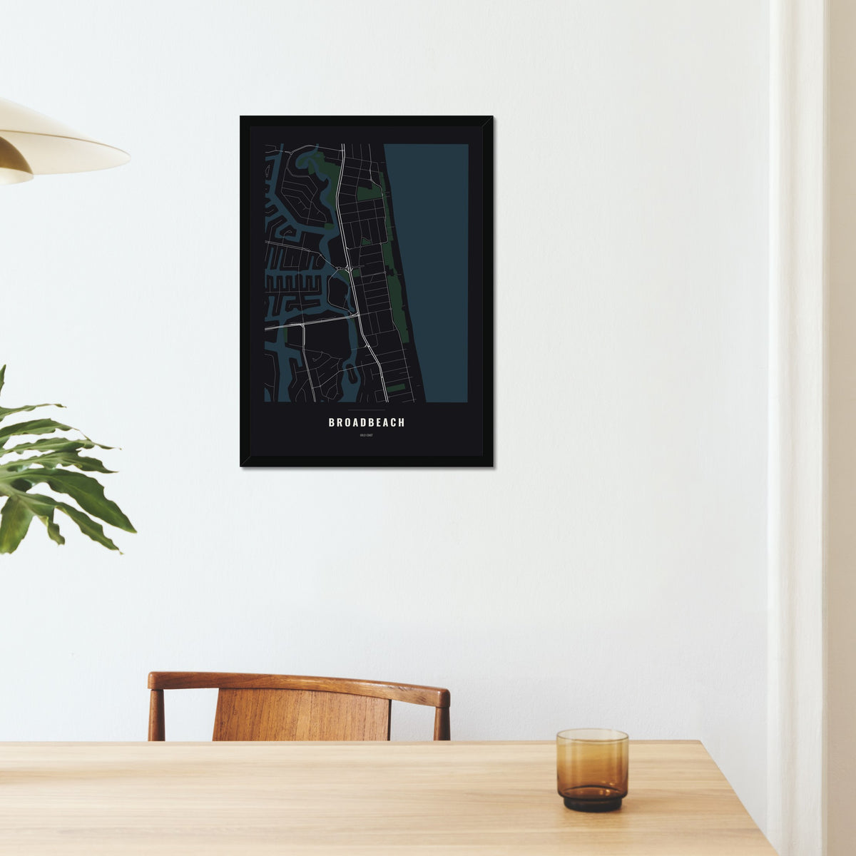 Broadbeach Map poster in a black frame on a dining room wall