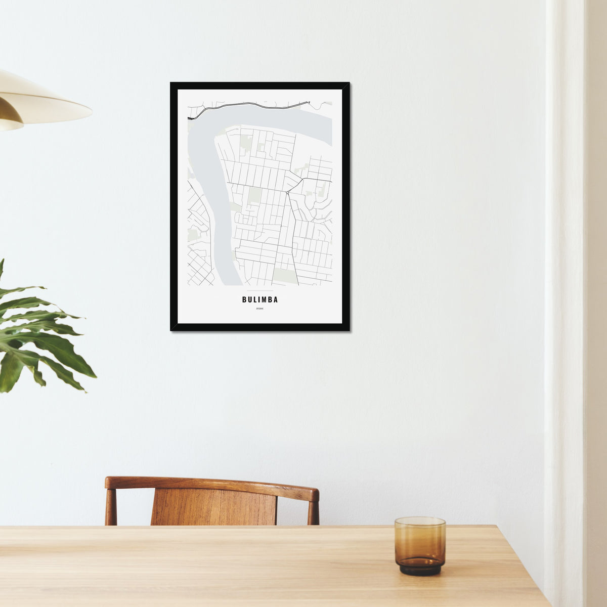 Bulimba Map poster in a black frame on a dining room wall