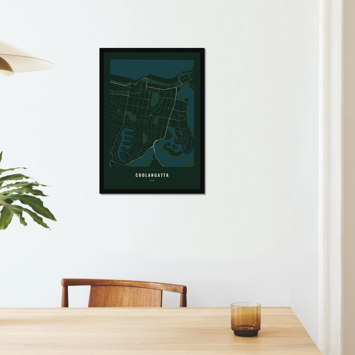 Coolangatta Map poster in a black frame on a dining room wall