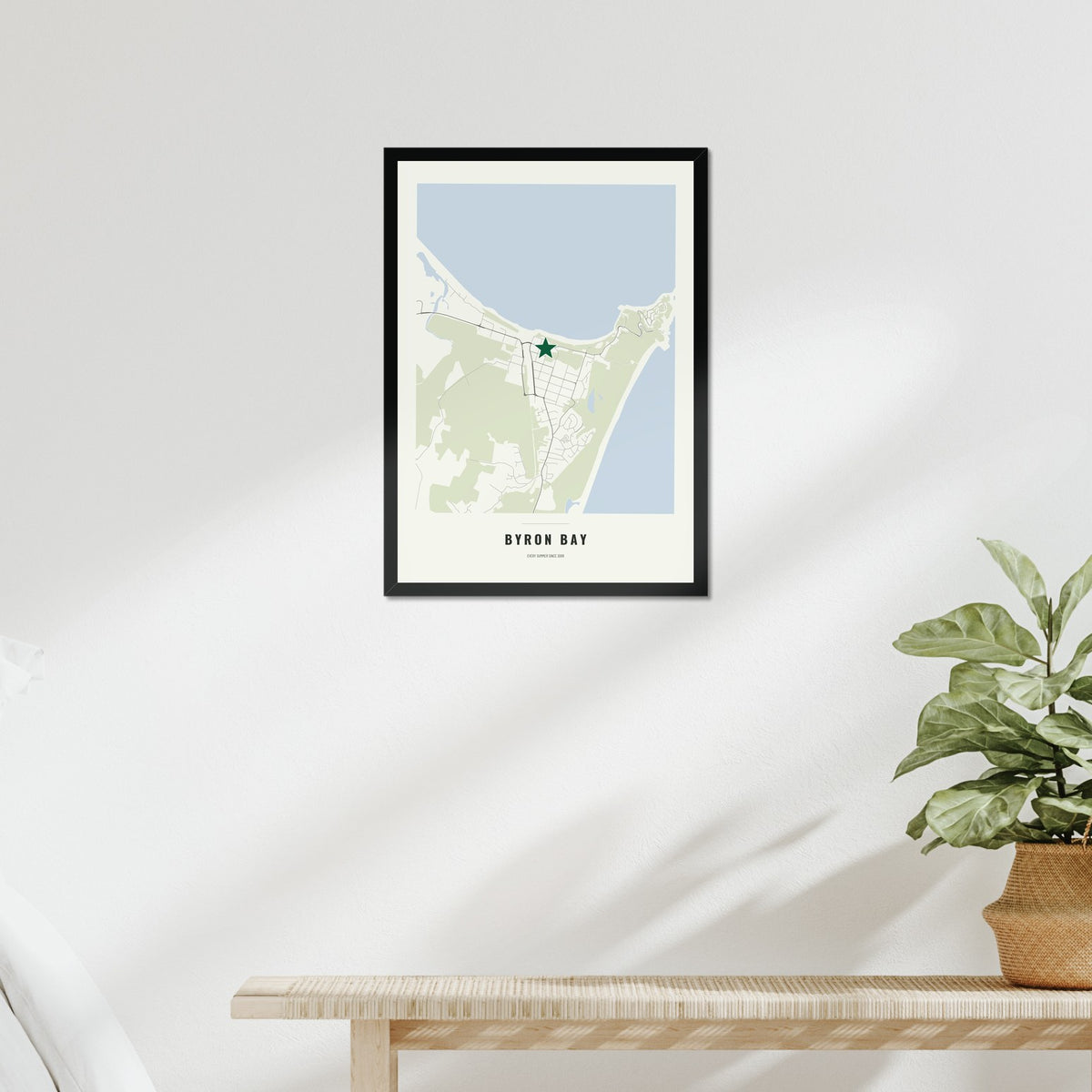 Favourite Place Map poster in a black frame above a bed