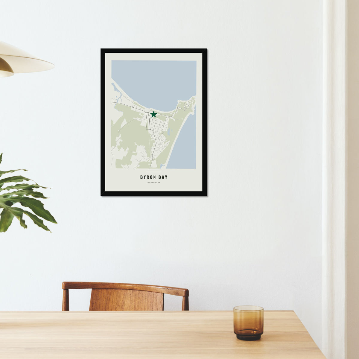 Favourite Place Map poster in a black frame on a dining room wall