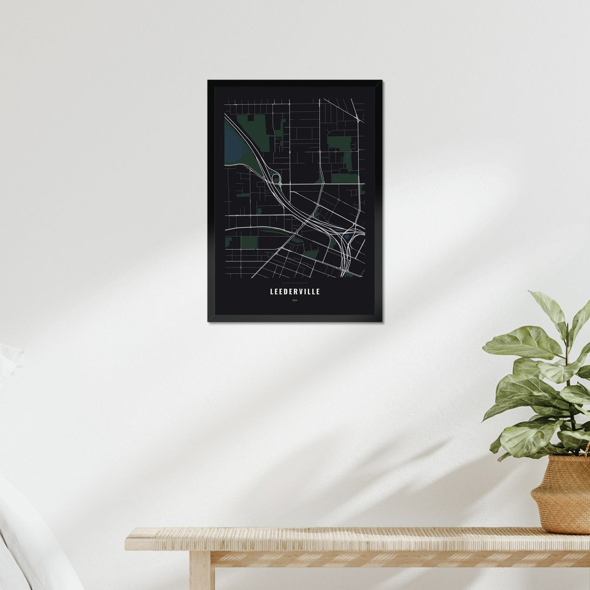 Leederville Map poster in a black frame above a bed