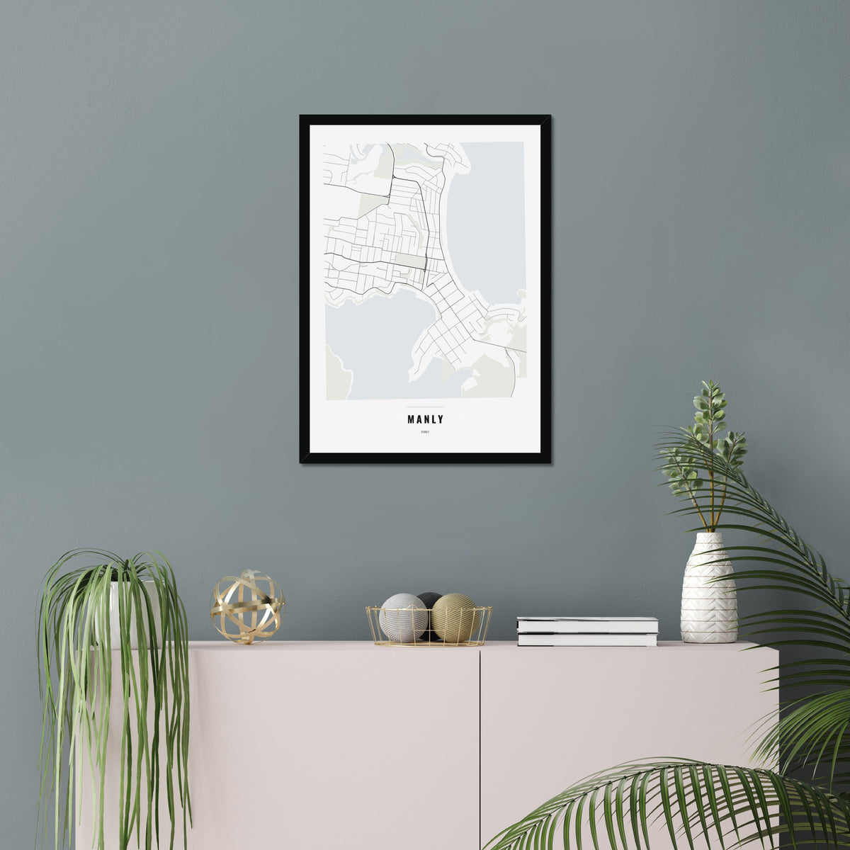 Manly Map poster in a black frame in a living room