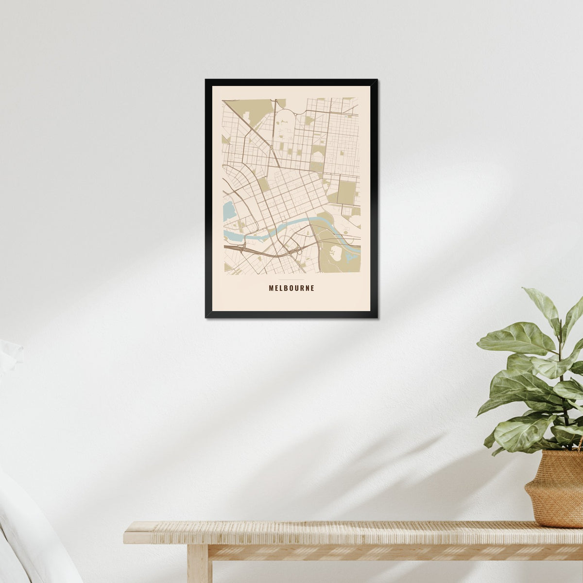 Melbourne City Map poster in a black frame above a bed