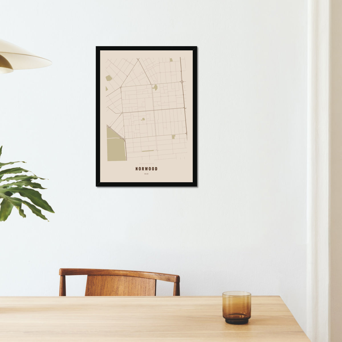 Norwood Map poster in a black frame on a dining room wall