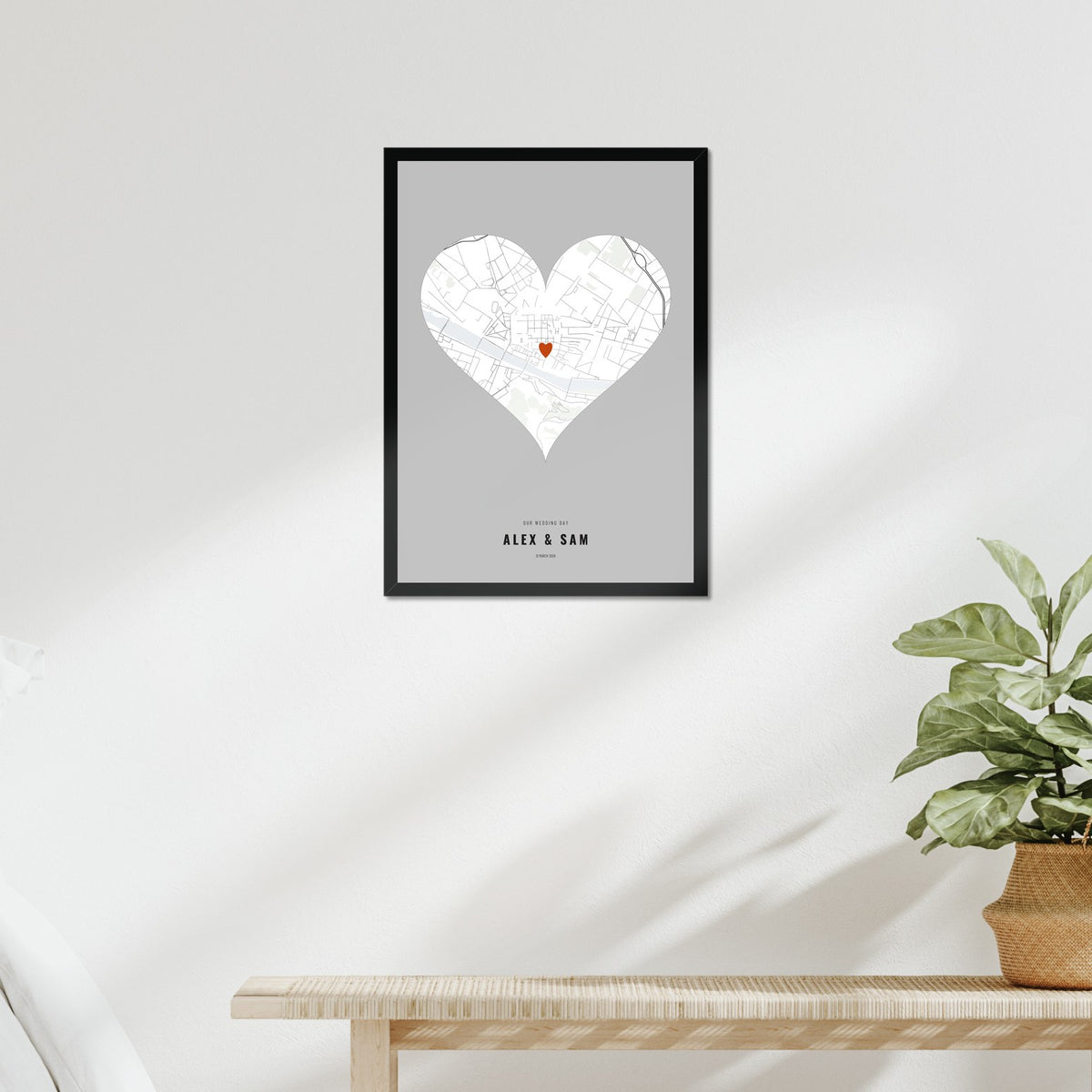 Our Wedding Day Map poster in a black frame above a bed