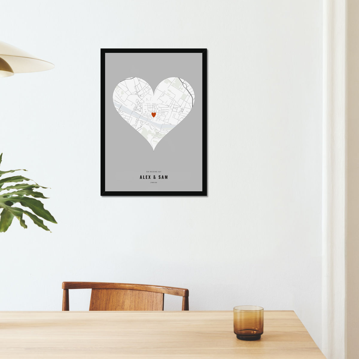 Our Wedding Day Map poster in a black frame on a dining room wall