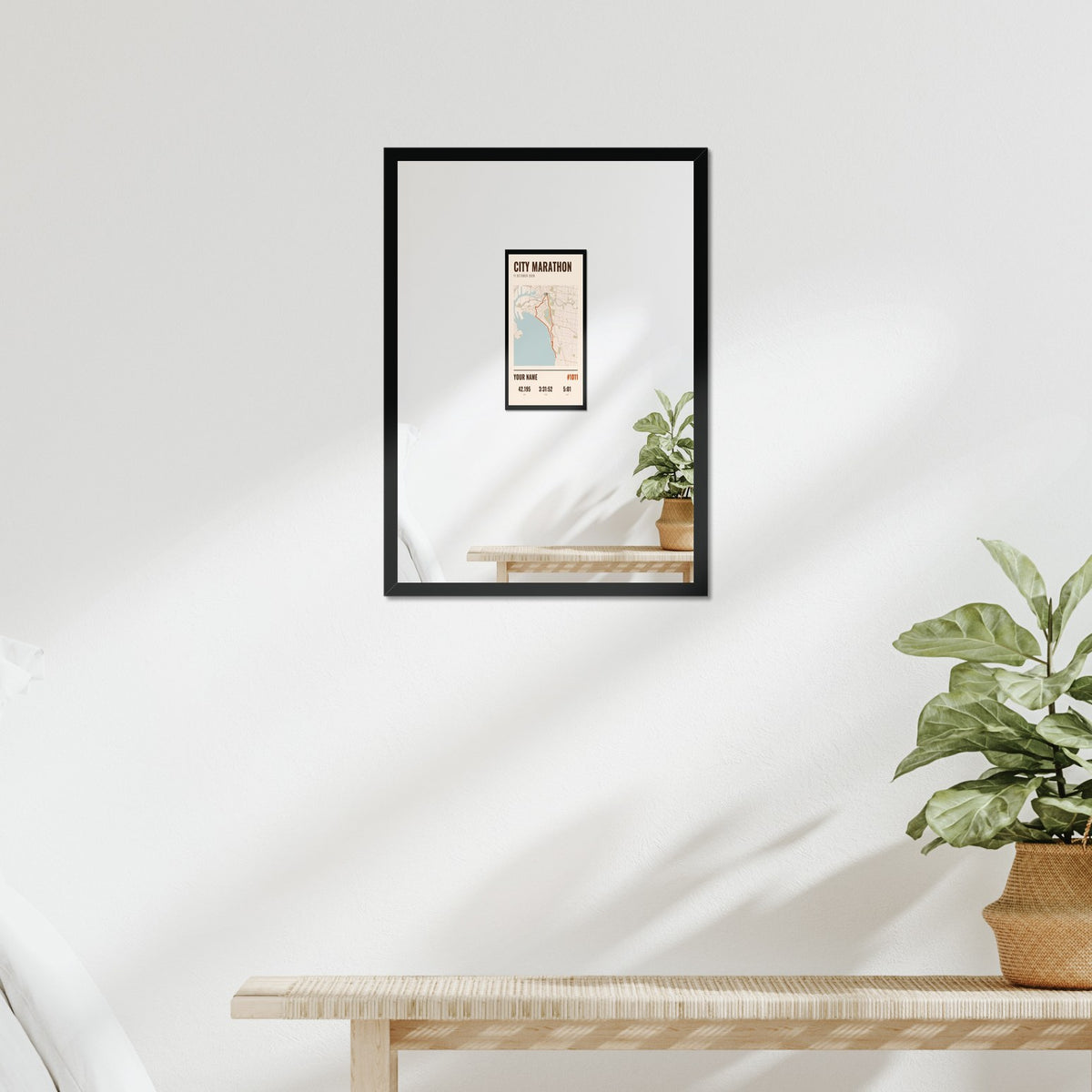 Example race map poster in a black frame above a bed