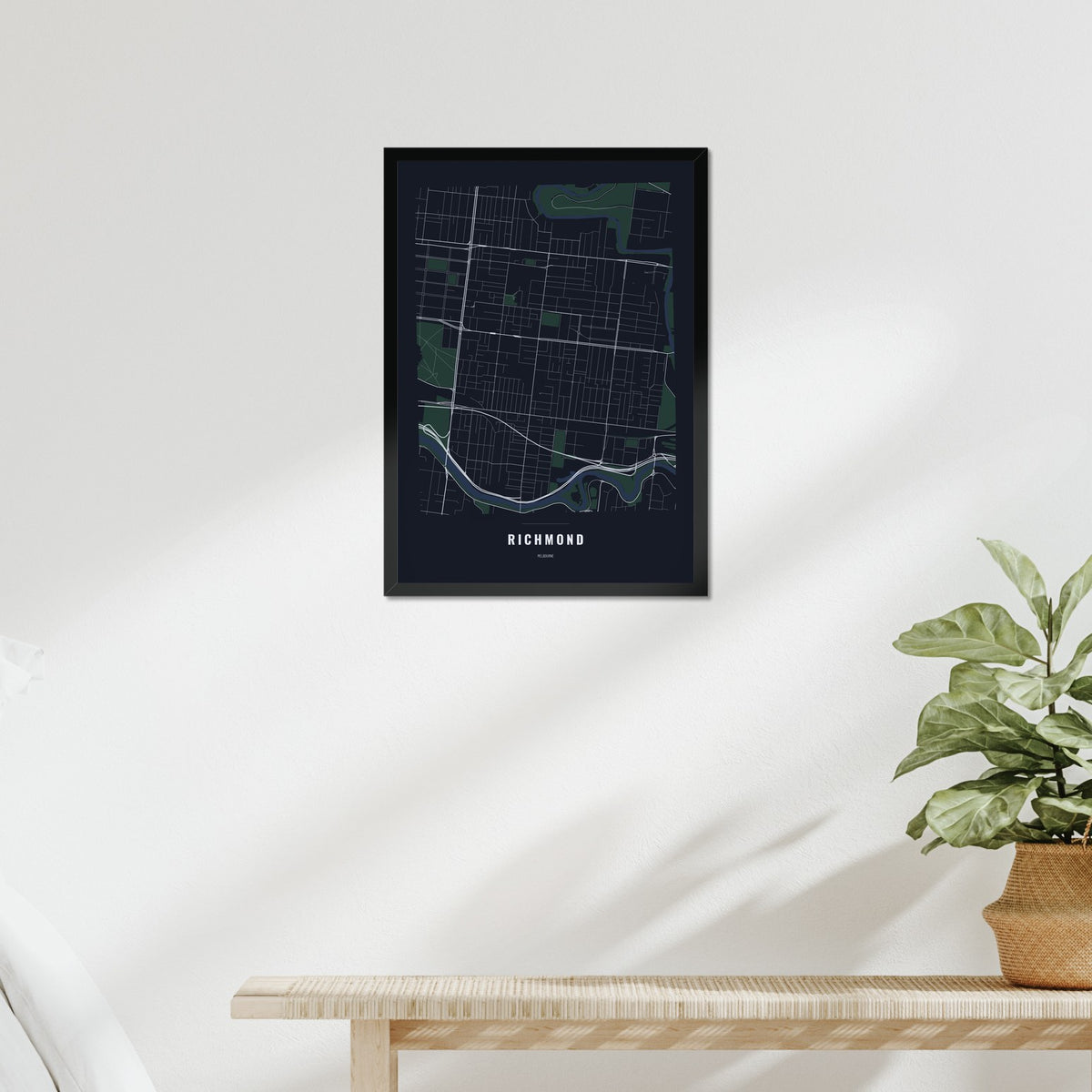 Richmond Map poster in a black frame above a bed
