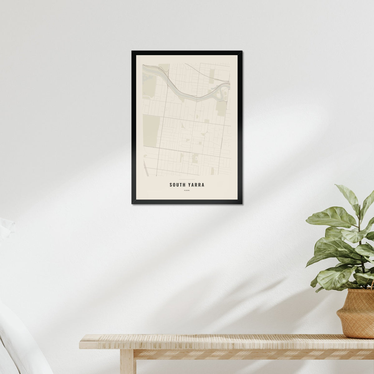 South Yarra Map poster in a black frame above a bed