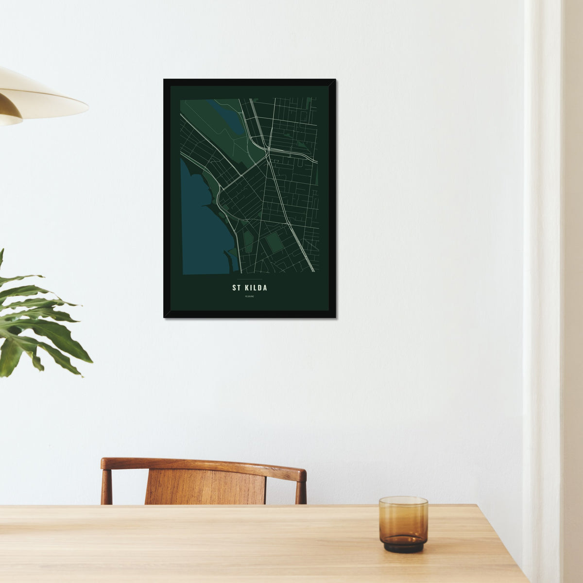 St Kilda Map poster in a black frame on a dining room wall
