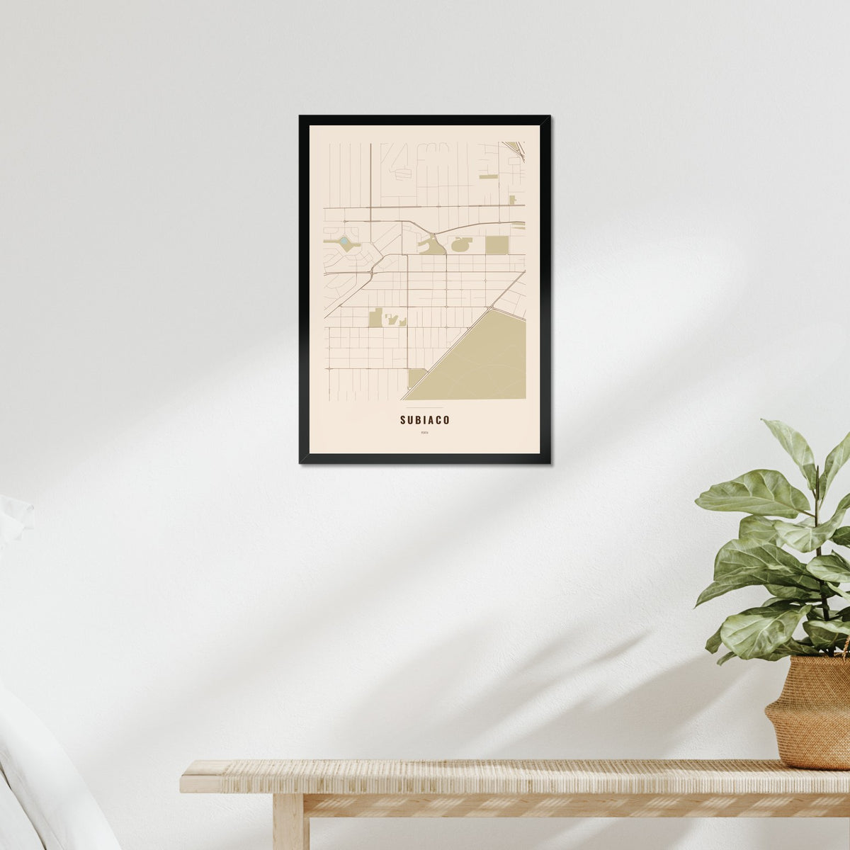 Subiaco Map poster in a black frame above a bed