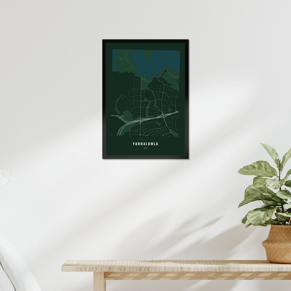 Yarralumla Map poster in a black frame above a bed